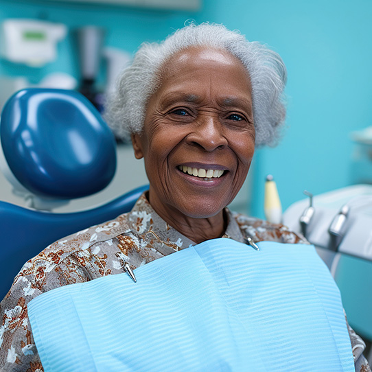 An old man smiles and checks her teeth