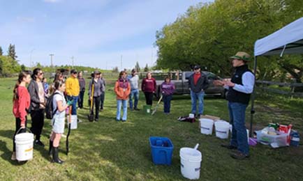 Group of people doing a workshop in the park.