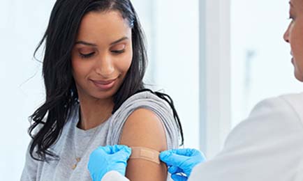 Young lady getting her COVID shot.