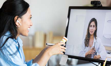 Woman talking to a health expert via videocall.